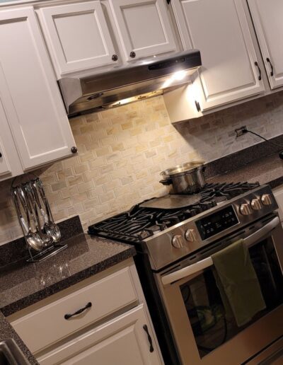 A kitchen with stainless steel appliances.