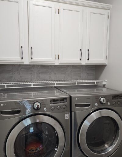 A laundry room with a washer and dryer.