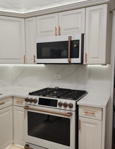 A white kitchen with a stove and oven.